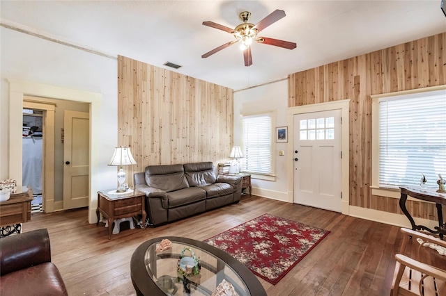 living room with ceiling fan and hardwood / wood-style flooring