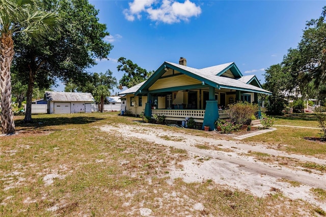 view of front of property featuring a garage and a porch