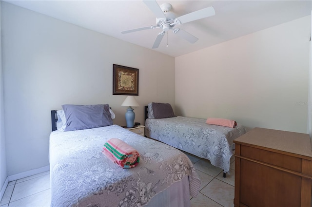 bedroom featuring ceiling fan and light tile flooring