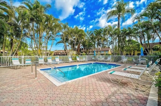 view of swimming pool featuring a patio