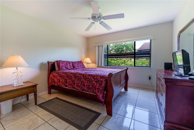 bedroom with ceiling fan and light tile floors