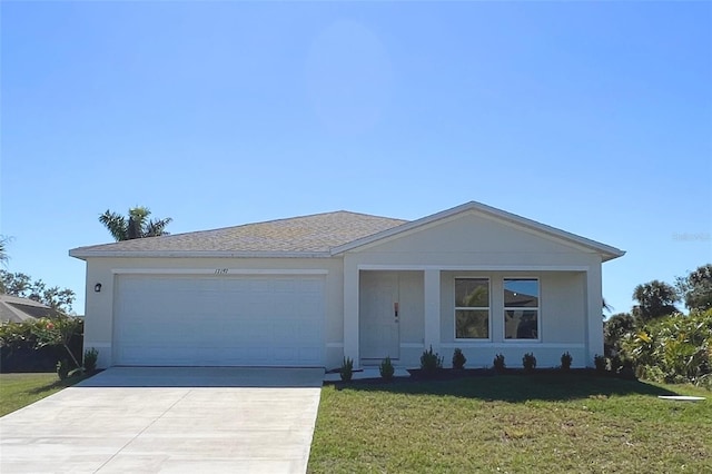 single story home with a front yard, an attached garage, concrete driveway, and stucco siding