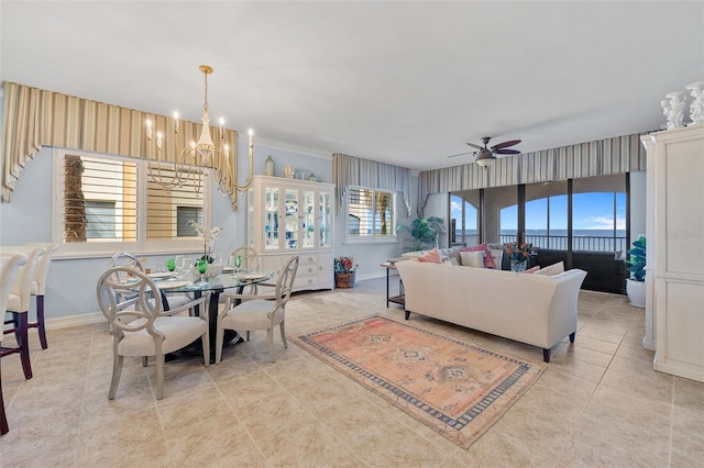 dining room with light tile flooring and ceiling fan with notable chandelier