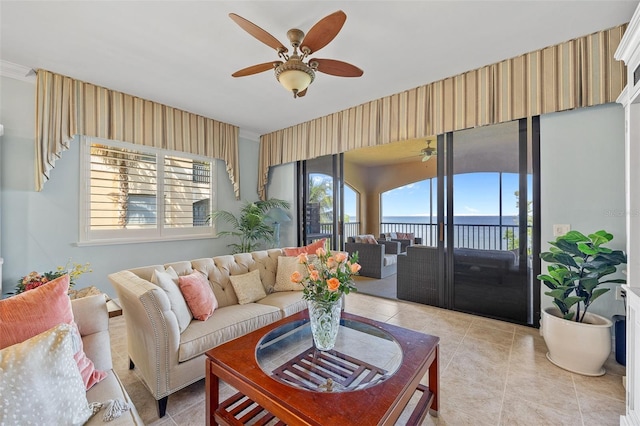 living room with ceiling fan and light tile floors