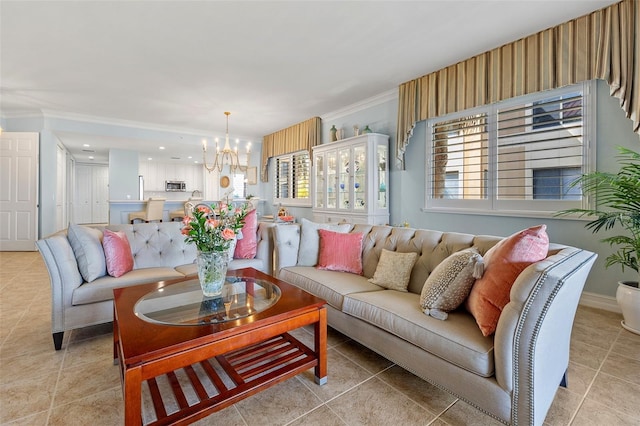 tiled living room featuring crown molding and an inviting chandelier