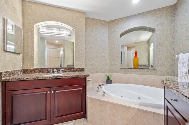 bathroom featuring vanity and plus walk in shower