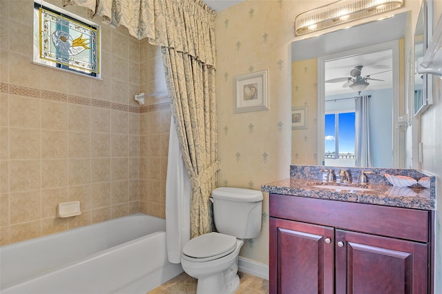 full bathroom with shower / bathtub combination with curtain, vanity, toilet, and ceiling fan