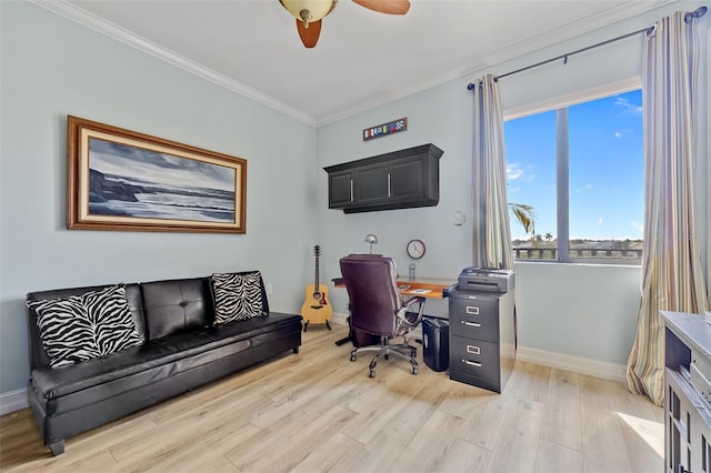 office area featuring ceiling fan, light hardwood / wood-style floors, and crown molding