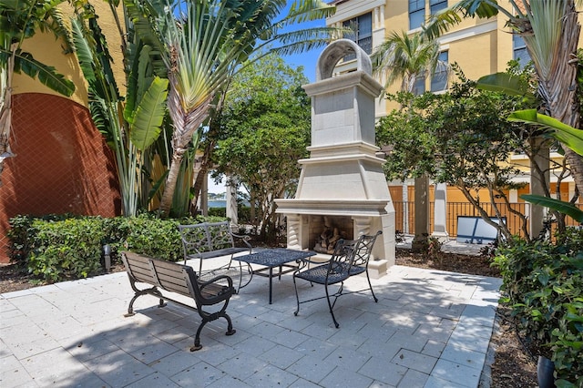 view of patio / terrace with an outdoor fireplace