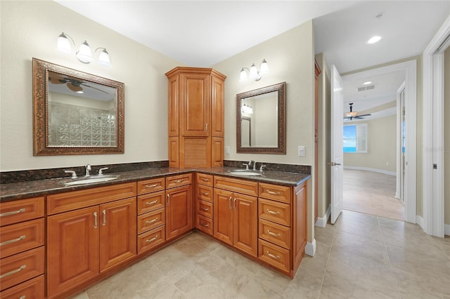 bathroom featuring double vanity, tile flooring, and ceiling fan