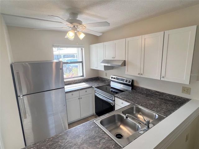 kitchen with stainless steel refrigerator, electric range, white cabinetry, and sink