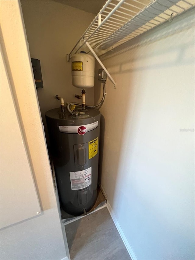 utility room featuring water heater