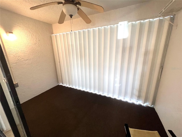 unfurnished room with ceiling fan