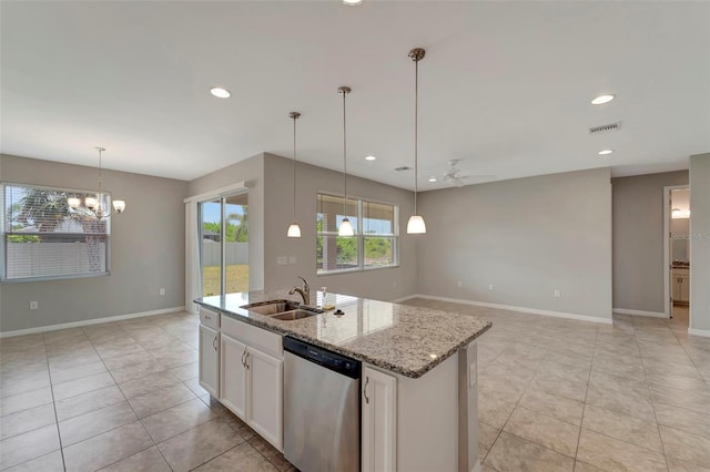 kitchen with hanging light fixtures, an island with sink, stainless steel dishwasher, white cabinets, and light tile floors