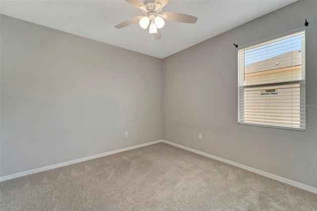 spare room with ceiling fan and carpet floors