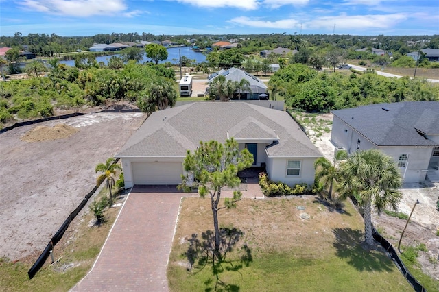 birds eye view of property with a water view