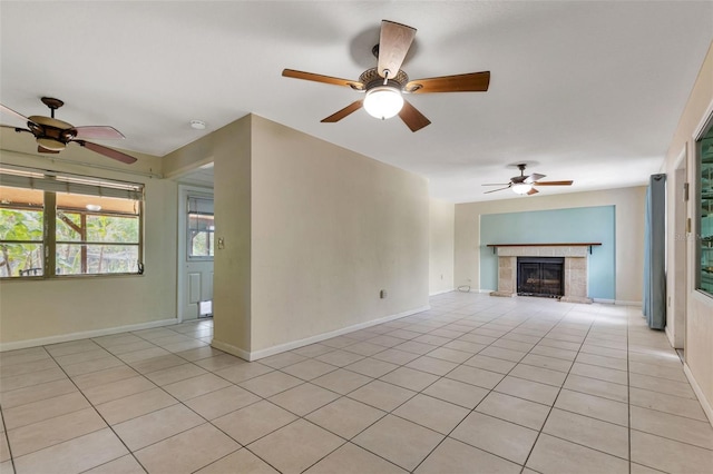 unfurnished living room with a fireplace and light tile patterned flooring