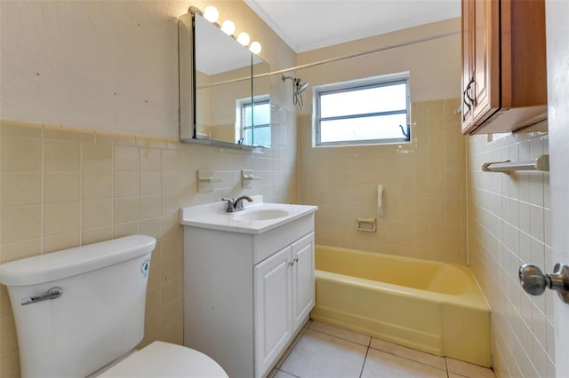 full bathroom with tile patterned floors, vanity, toilet, and tile walls