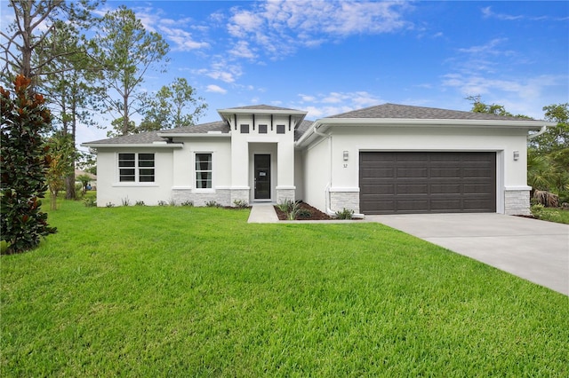 prairie-style house featuring a front yard and a garage