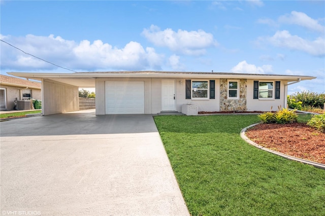 single story home featuring a garage, a carport, and a front lawn