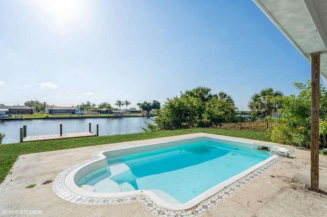 view of swimming pool featuring a water view and a patio area