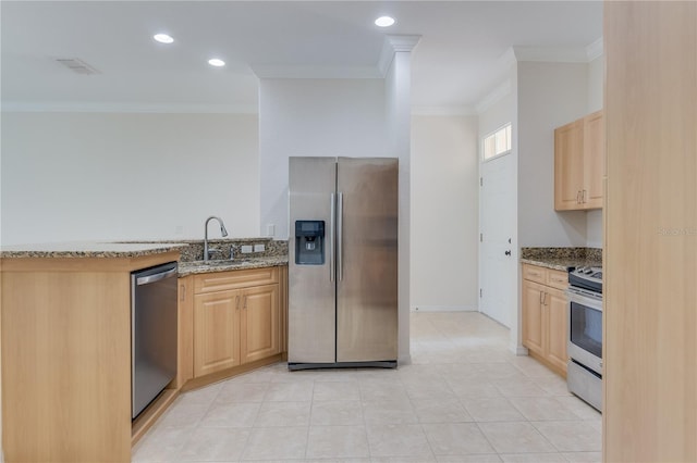 kitchen with crown molding, stainless steel appliances, light stone counters, light tile floors, and light brown cabinets