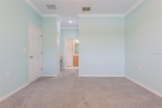 carpeted empty room with crown molding