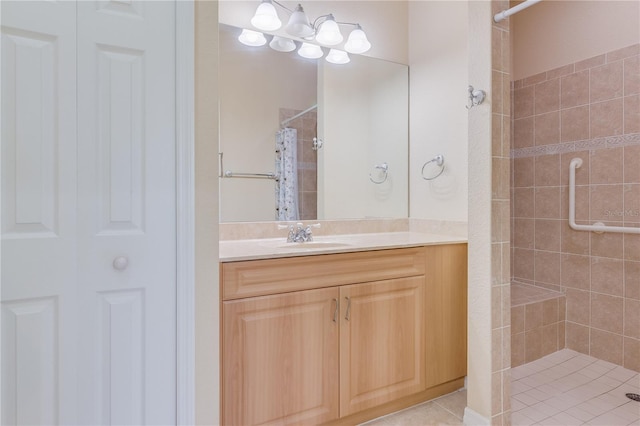 bathroom featuring walk in shower and vanity