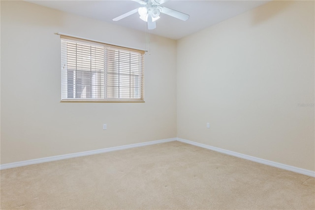 unfurnished room featuring carpet and ceiling fan