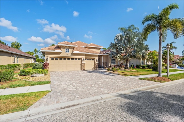 mediterranean / spanish-style house with a front yard