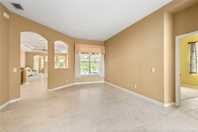 unfurnished room featuring light tile floors