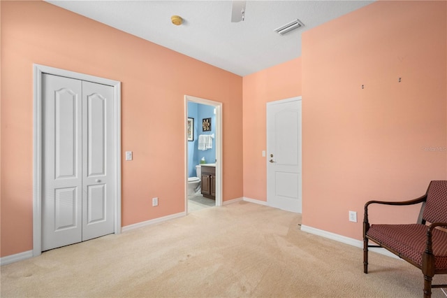 living area with light colored carpet