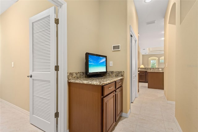 hall with light tile floors