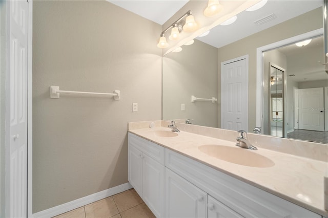 bathroom featuring dual sinks, tile floors, and large vanity