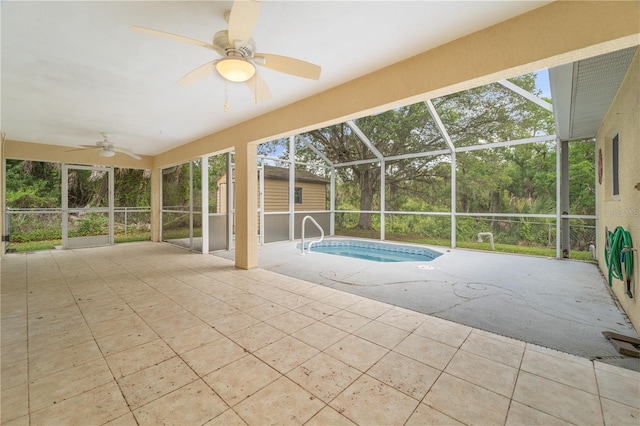 view of pool with ceiling fan, a lanai, and a patio