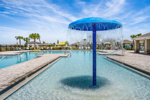 view of swimming pool featuring a patio area