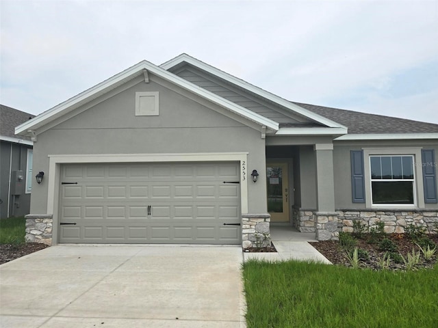 single story home featuring a garage