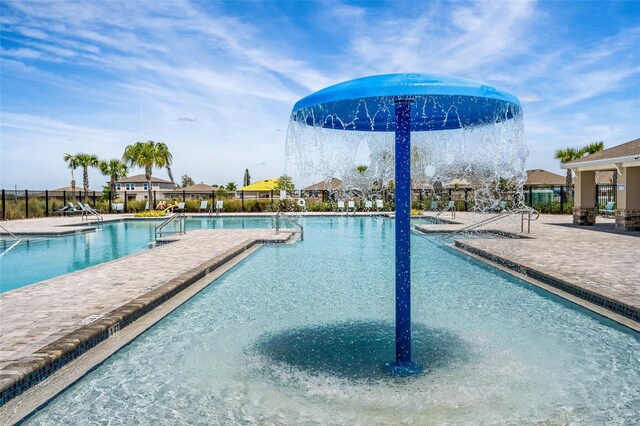 view of swimming pool with a patio area