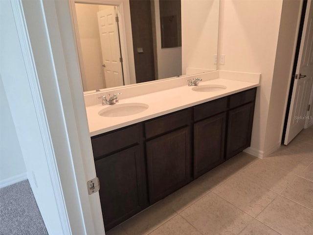 bathroom featuring tile floors and dual bowl vanity