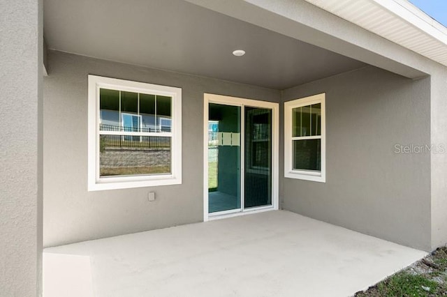 doorway to property with a patio