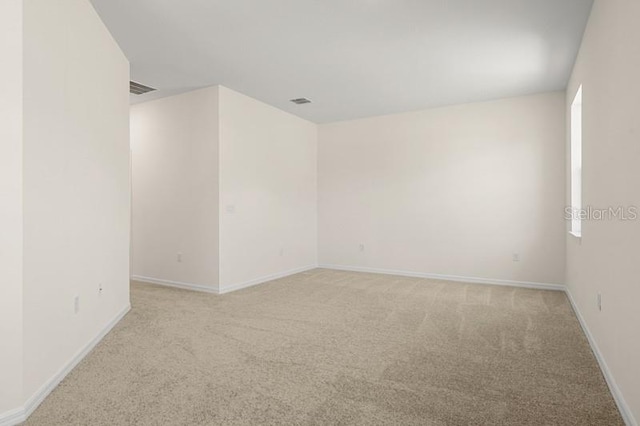 spare room featuring carpet