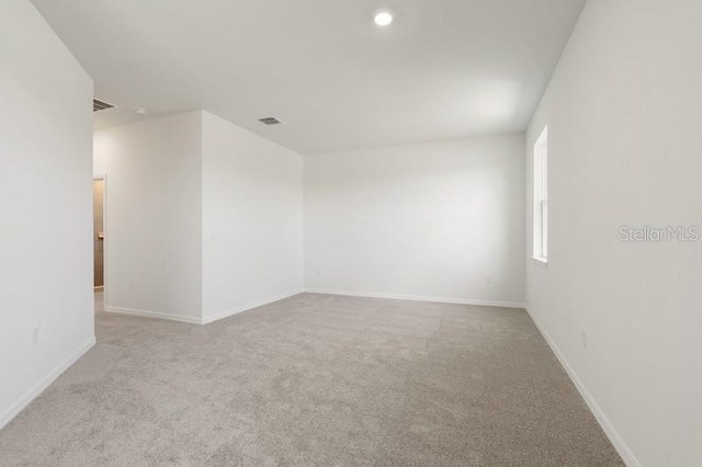 spare room with carpet floors