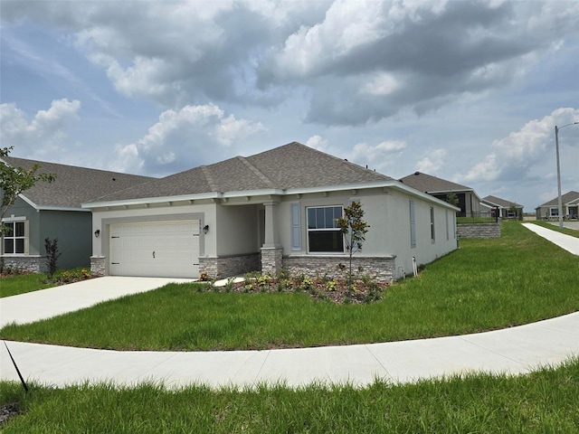 view of front facade with a front lawn and a garage