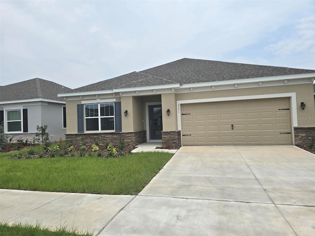 view of front facade featuring a garage and a front yard