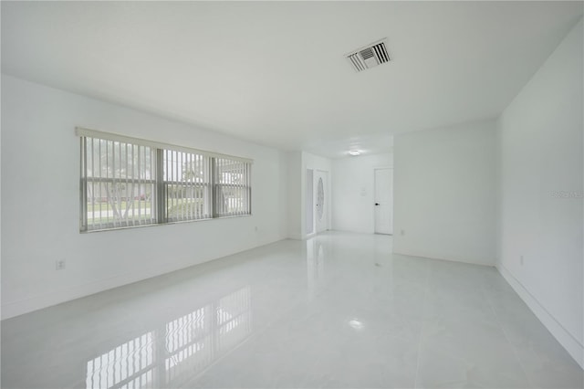 spare room with tile flooring