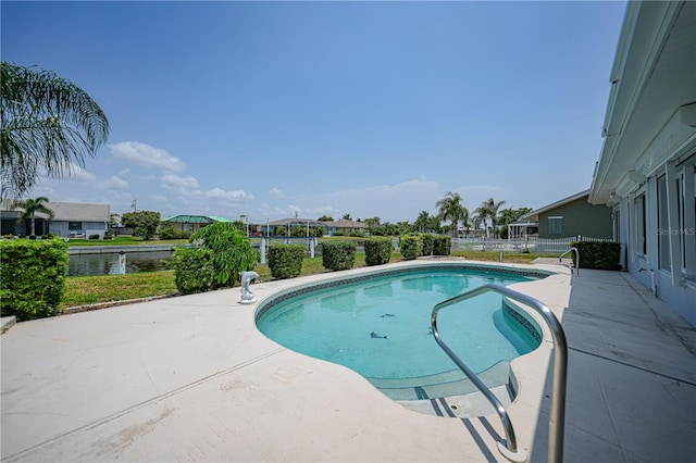 view of swimming pool with a patio