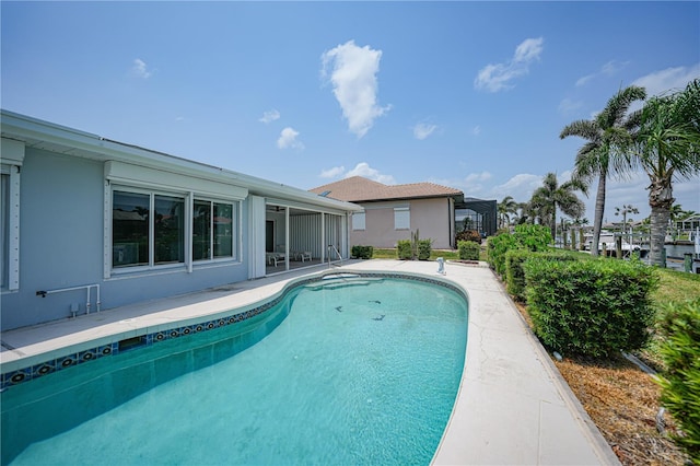 view of swimming pool with a patio area