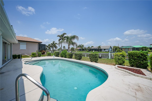 view of swimming pool featuring a patio