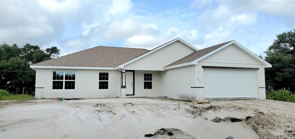 ranch-style home featuring a garage