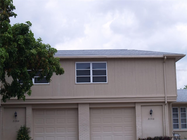 view of side of home with a garage